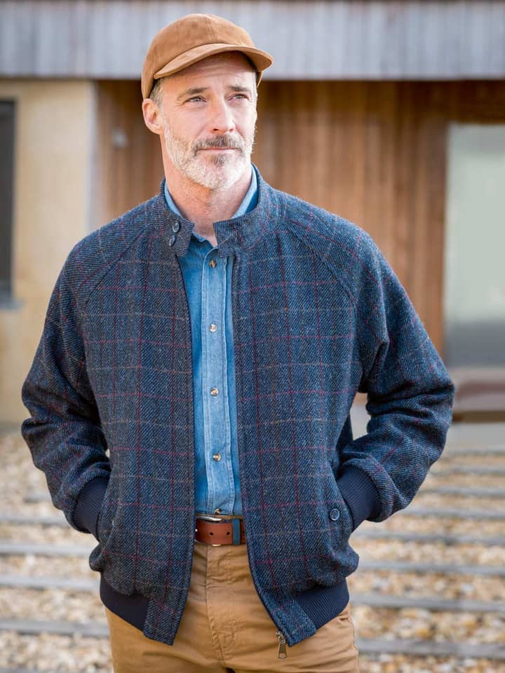 Model wears Navy Harris Tweed Harrington Jacket